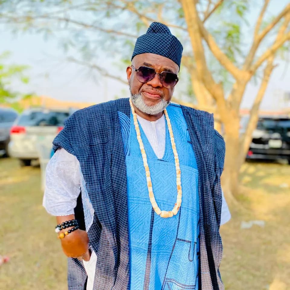 T. Akinbohun, Founder and Chief Executive Officer of Event Squad, in blue aso-oke and a matching cap